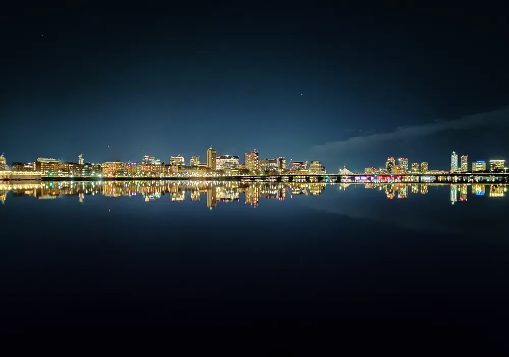 Boston skyline reflected across the Charles River