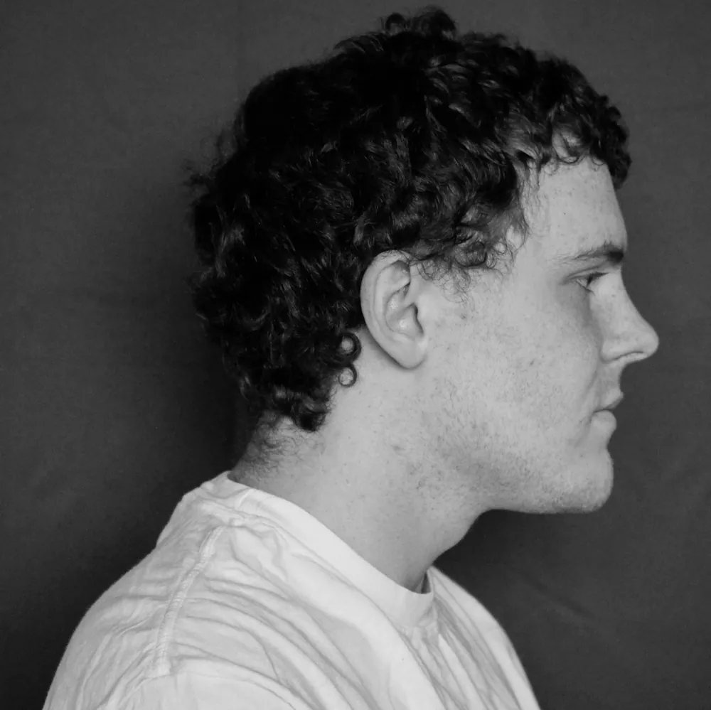 Black-and-white portrait of Joe outdoors