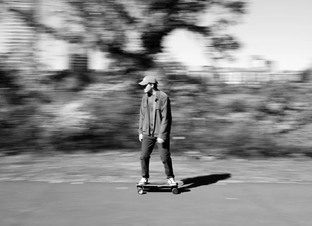 Electric skateboard long-exposure light trail